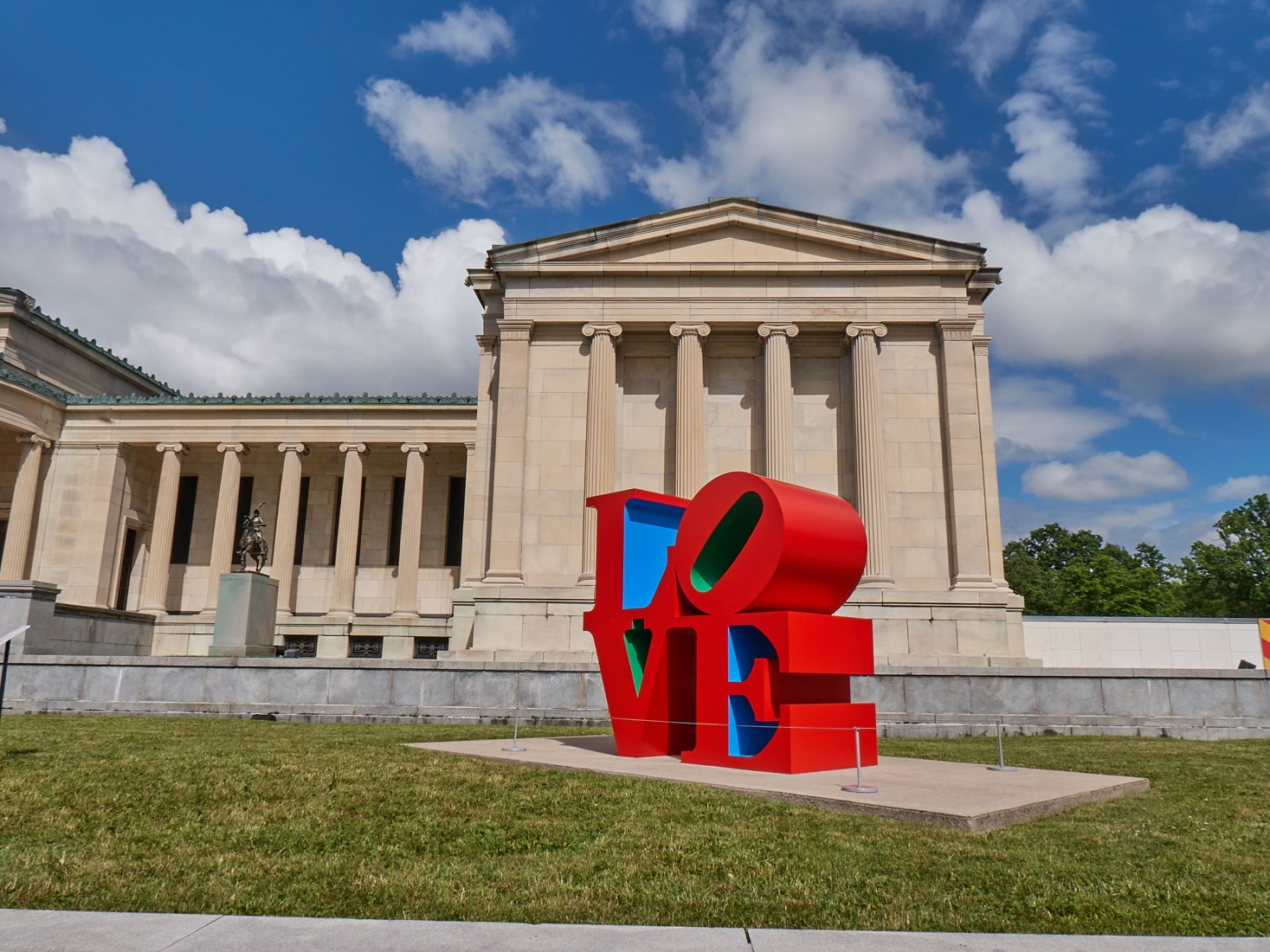 LOVE (red blue green) on display in front of the Albright-Knox for the exhibition Robert Indiana: A Sculpture Retrospective, 2018