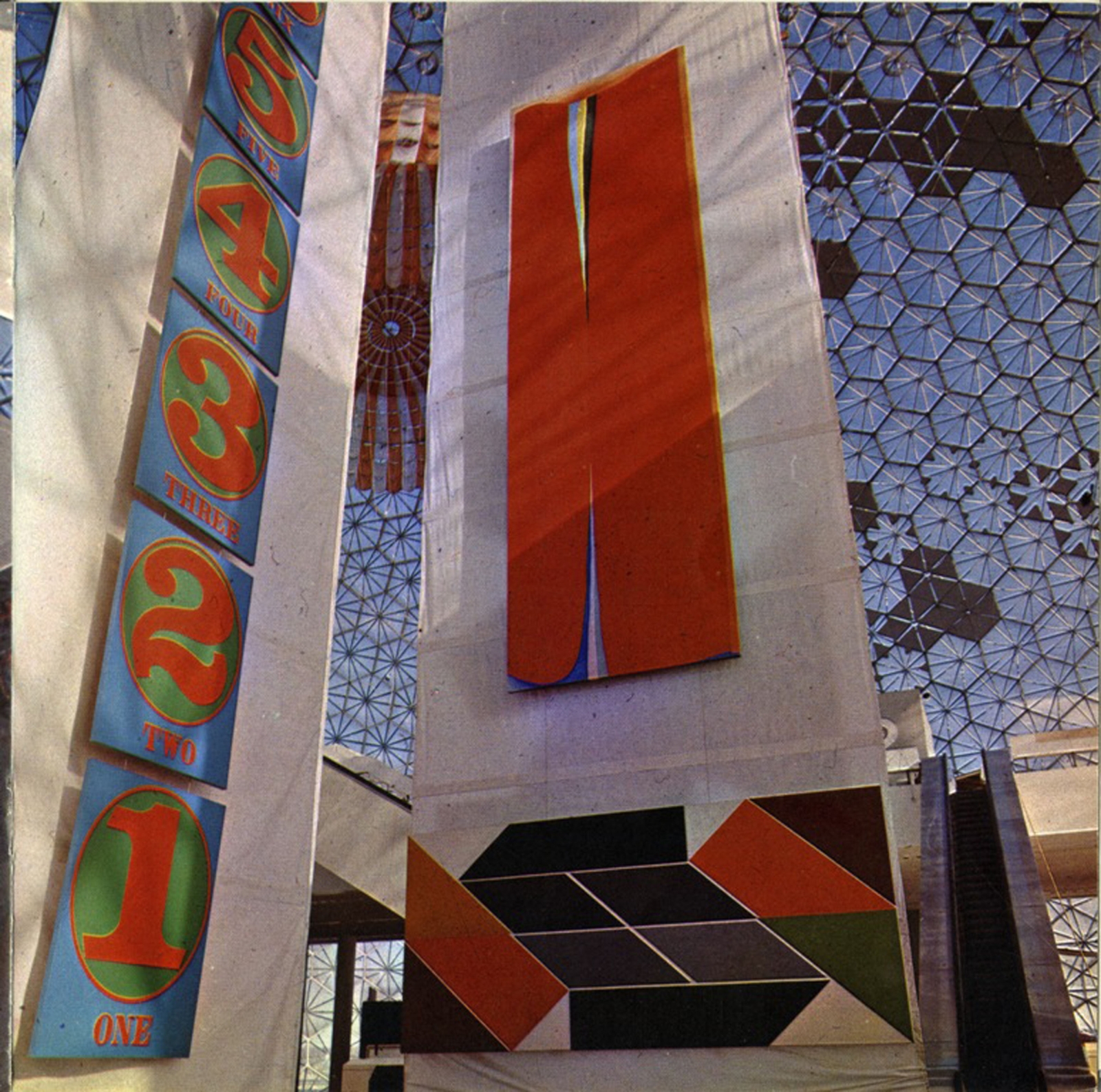 Installation view of, on the left, Indiana&#39;s The Cardinal Numbers (1966) in the American Pavilion, designed by Buckminster Fuller, at Expo &rsquo;67 in Montreal