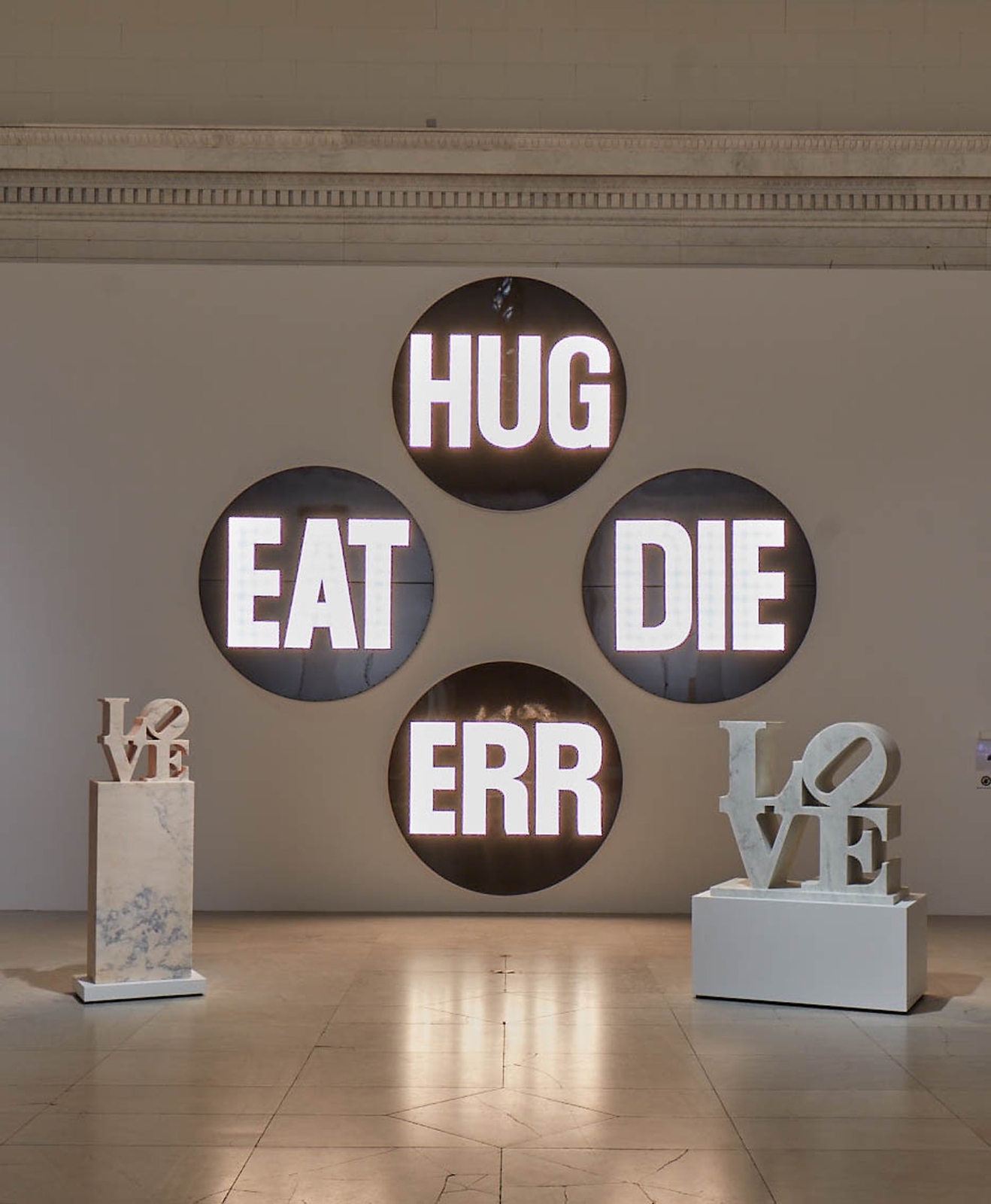 Installation view of&amp;nbsp;Robert Indiana: A Sculpture Retrospective&amp;nbsp;in the Albright-Knox Art Gallery, Buffalo, June 16&amp;ndash;September 23, 2018; left to right,&amp;nbsp;LOVE&amp;nbsp;(2005),&amp;nbsp;The Electric American Dream (EAT/DIE/HUG/ERR)&amp;nbsp;(2007), and&amp;nbsp;LOVE&amp;nbsp;(2006)&amp;nbsp;