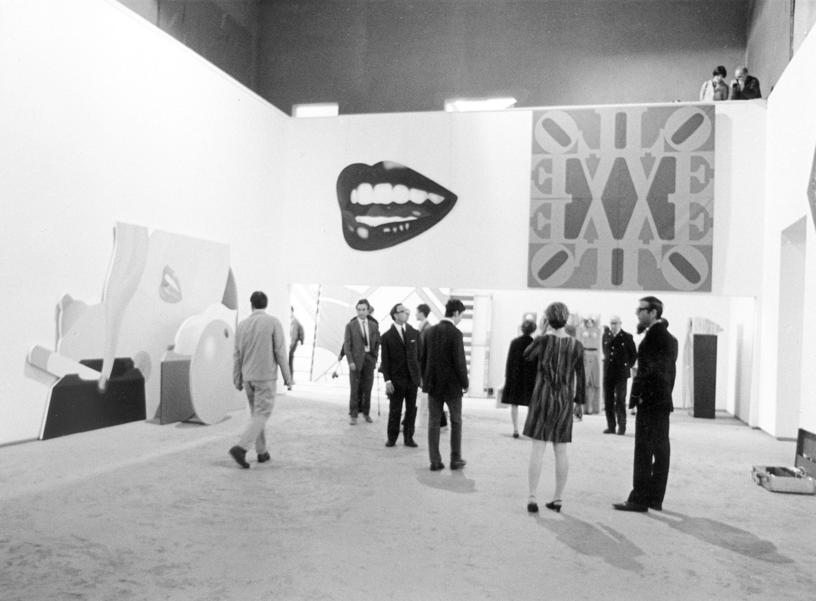 Installation view, Documenta 4, Kassel, Germany; left to right, Tom Wesselman&amp;#39;s Great American Nude No. 98 (1967) and Mouth No. 15 (1968) and Indiana&amp;rsquo;s LOVE Wall (1966), with the panels hung incorrectly