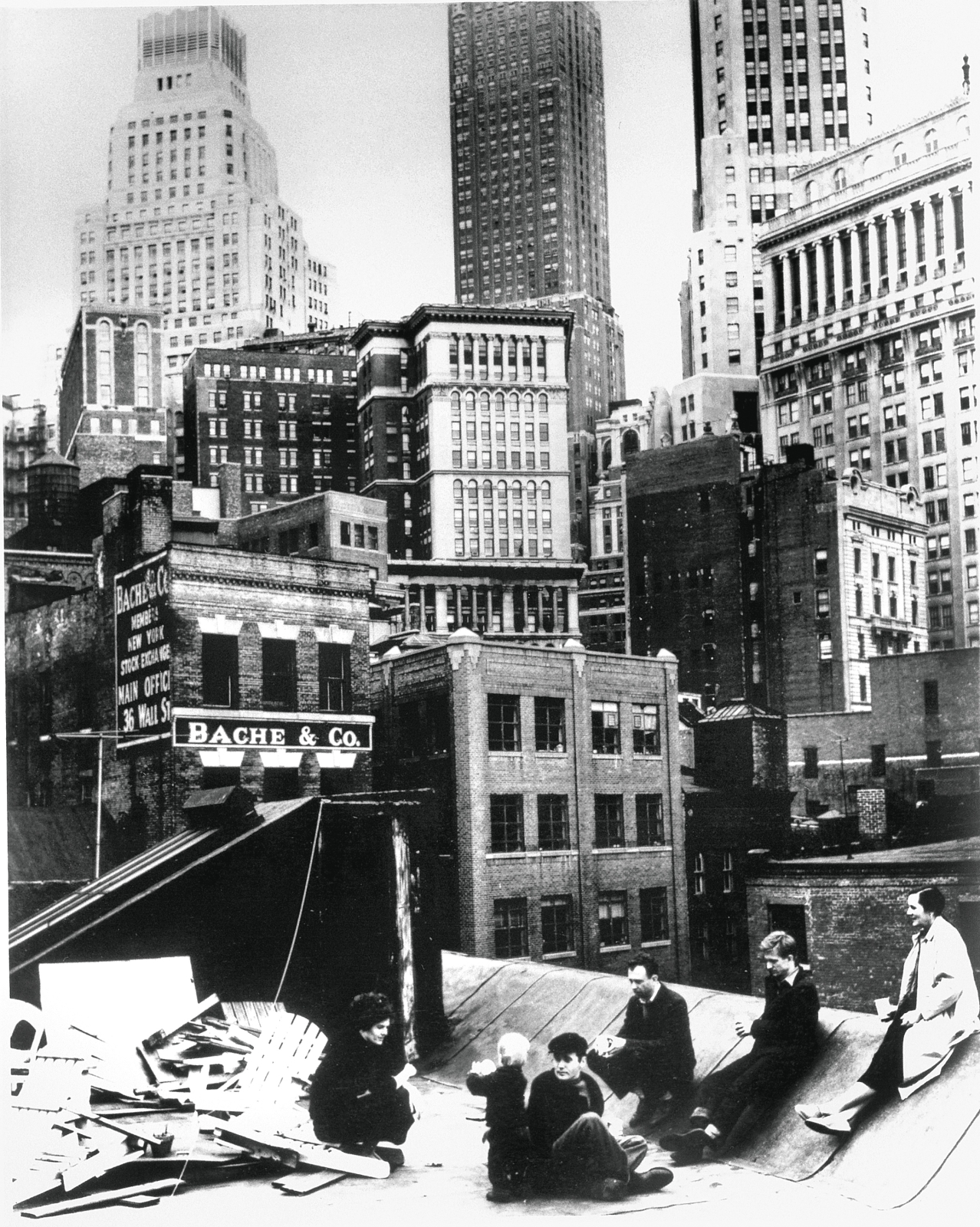 Artists on the roof of 3-5 Coenties Slip (left to right: Delphine Seyrig, Duncan Youngerman, Robert Clark, Ellsworth Kelly, Jack Youngerman and Agnes Martin), 1958. Photo: Hans Namuth/Posthumous digital reproduction from original negative/ Hans Namuth Archive, Center for Creative Photography&nbsp;&copy; 1991 Hans Namuth Estate