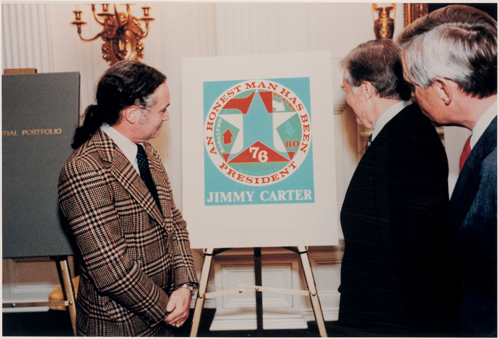 Indiana, left, presenting his serigraph&nbsp;An Honest Man Has Been President, to President Jimmy Carter and Vice President Walter Mondale, The White House, Washington, D.C., January 1981. Image courtesy of The Star of Hope, Vinalhaven, Maine