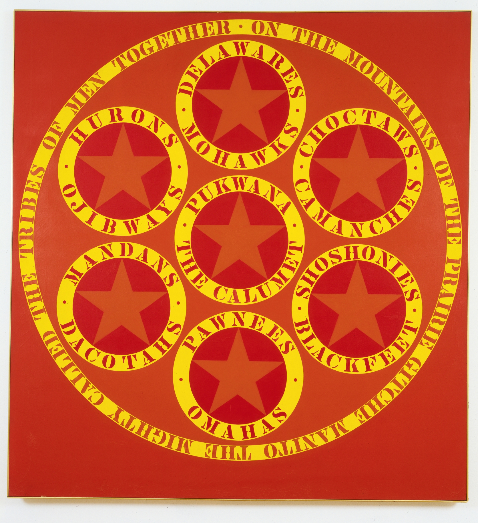 A red 90 by 84 inch canvas titled "The Calumet." A large circle containing seven smaller circles dominates the canvas. The seven smaller circles each hold an orange star, and are surrounded by the names of different Native American tribes painted in red stenciled letters in an outer yellow ring.  A yellow ring encloses the large circle, and contains the red stenciled text "On the mountains of the prairie Gitche Manito the mighty called the tribes of men together."