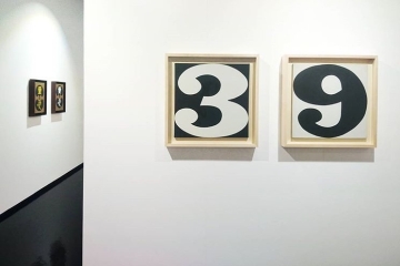 Installation image of the exhibition Robert Indiana at the Pinacoteca Comunale Casa Rusca in Locarno, Switzerland. Shown are the paintings Three and Nine