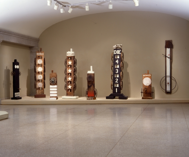 Installation view of Robert Indiana: Wood Works, National Museum of American Art, Washington, D.C.; left to right: Ge (1960), Bar (1960), Hole (1960), Two (1962), Chief (1962), and Virgin (1960) 