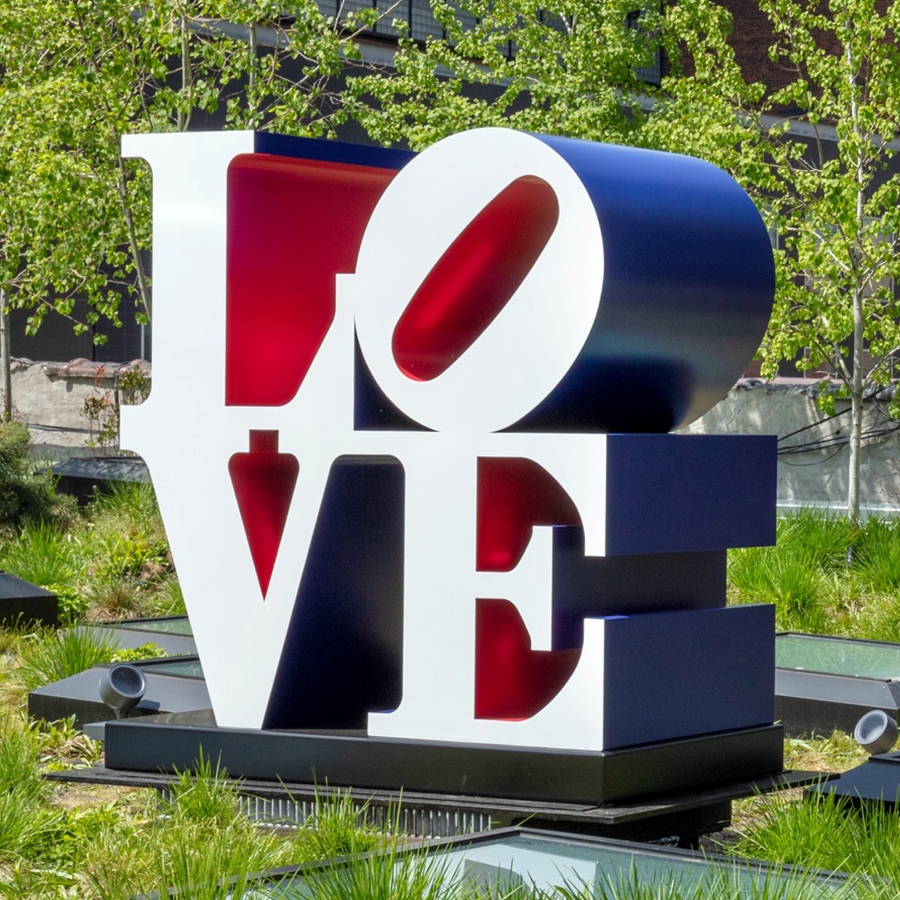 he American LOVE is a 72 by 72 by 36 inch polychrome aluminum sculpture spelling love, consisting the letters L and a tilted letter O on top of the letters V and E. The faces of the letters are the color white, the sides are blue, and the insides are red