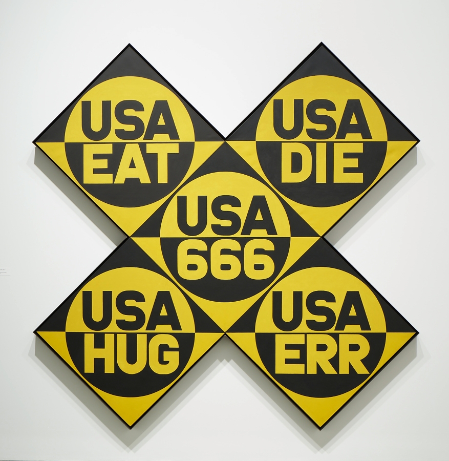 USA 666 (The Sixth American Dream)  is a yellow and black x-format painting, made up of five panels and measuring 102 by 102 inches overall. Each panel has a circle divided in two, the top half yellow with USA painted in black, and the bottom black with a yellow word. The words are, clockwise from top left, "EAT,""DIE," "ERR," "HUG," and in the central panel "666."