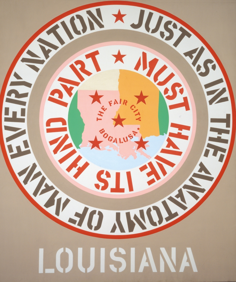 A 70 by 60 inch beige canvas with the title, Louisiana, painted in white stenciled letters across the center bottom edge of the painting. Above the title and dominating the canvas is a large circle consisting of a pink image of the state of Louisiana in the middle, with "The Fair City Bogalusa" shown on the map. Around this image is a white ring with stenciled red text surrounded by a beige ring and another white ring with brown stenciled text. The text reads, starting in the outer ring, "Just as in the anatomy of man every nation," and in the inner ring "must have its hind part."