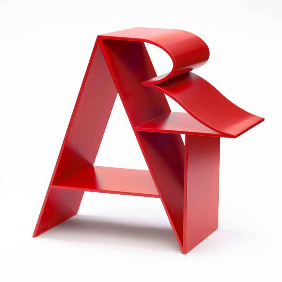 Art is an 18 by 18 by 9 inch red polychrome aluminum sculpture. The letter "A” forms a supporting structure that the “R” and “T” lean against.