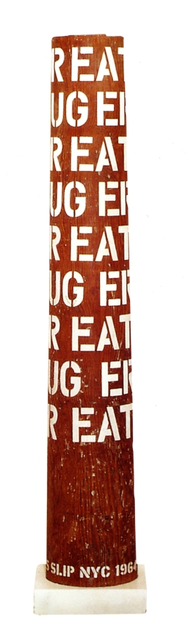 A column with nine rows of the words eat, hug, and err in gesso stenciled letters wrapping around the upper three quarters of the sculpture. 